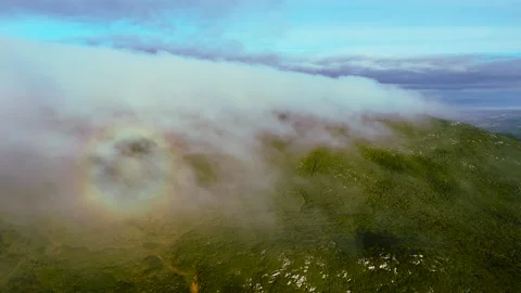 Flying over the clouds on top of the mountain | Aerial Drone Shot Stock Footage 168493383