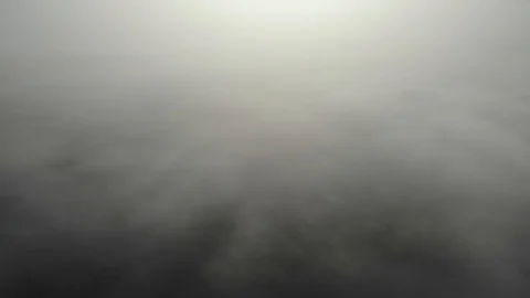 Flying over clouds. Video shot by drone in early morning. Smog above city. Real Stock Footage 123435078