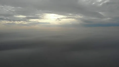 Flying over clouds. Video shot by drone in early morning. Smog above city Stock Footage 123610782
