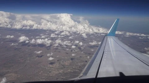 Flying over the clouds. View from plane aircraft. Stock Footage 78385444