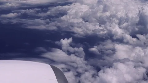 Flying over the clouds. View from plane aircraft. Stock Footage 79596004