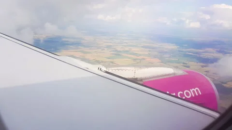 Flying over the clouds. View from plane aircraft passenger window with clouds Stock Footage 138581899