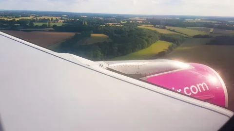 Flying over the clouds. View from plane aircraft passenger window with clouds Stock Footage 138581953