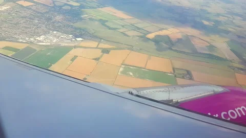 Flying over the clouds. View from plane aircraft passenger window with clouds Stock Footage 138582383