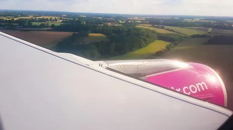 Flying over the clouds. View from plane aircraft passenger window with clouds 스톡 사진