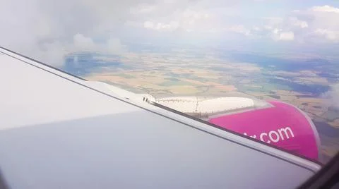 Flying over the clouds. View from plane aircraft passenger window with clouds 스톡 사진