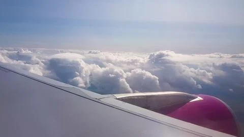 Flying over the clouds. View from plane aircraft passenger window with clou.. Fotos Stock