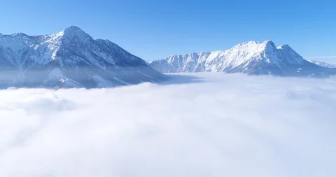 Flying over the clouds, Winter Panorama, Austria Stock Footage 98891307