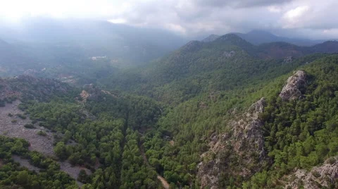 Flying Over Cloudy Mountain. Captured by Drone Cam Stock Footage 65219403