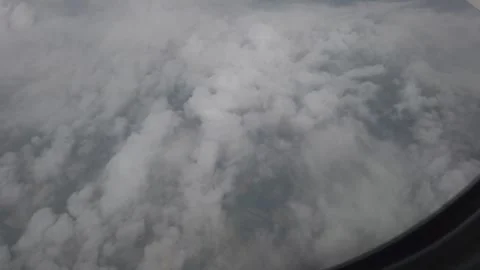 Flying over the cloudy, snowy mountan area Video stock 279682479