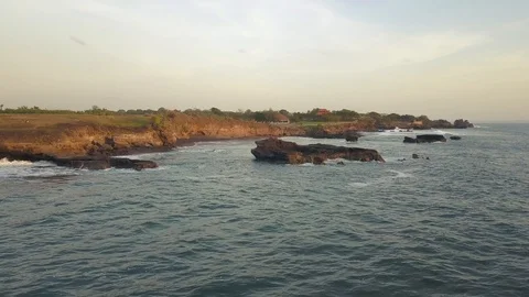 Flying over the coast during the surf Stock Footage 123158612