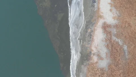 Flying over the coastline of the river in the winter. Stock Footage 100126394