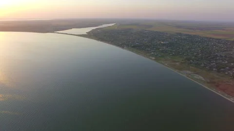 Flying over coastline at sunset. Stock Footage 67673700