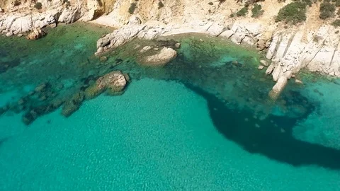 Flying over colorful sardinia mediterranean sea coastline at sunrise Stock Footage 75531153