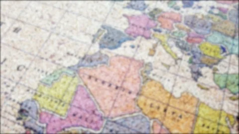 Flying over colorful world map blurred background Stock Footage 122339100