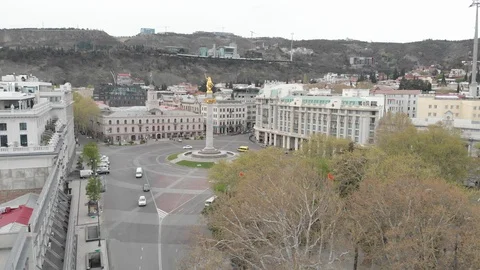 Flying over column of freedom in the center of Tbilisi. St. George monument Stock Footage 128865052