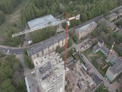 Flying over a construction crane on top Stock Footage 76103125