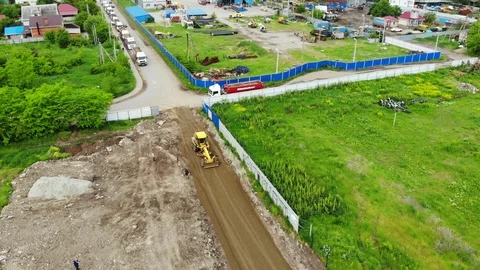 Flying over construction equipment. Construction of the road from the air. Stock Footage 111527844