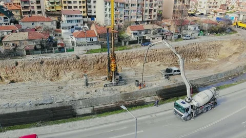 Flying over the construction site, building a new road and street in urban area. 動画素材 99040331