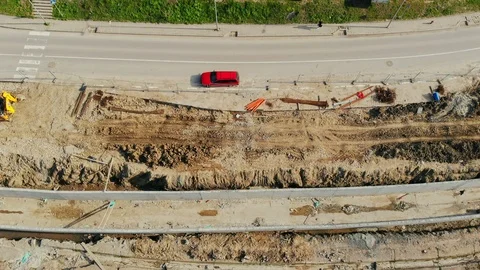 Flying over the construction site, building a new road and street in urban area. Stock Footage 99043396