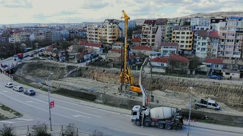 Flying over the construction site, building a new road and street in urban area. Video stock 99101946