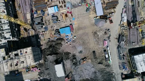 Flying over construction site. Excavators remove rubble, stones. Drone footage Stock Footage 155792348