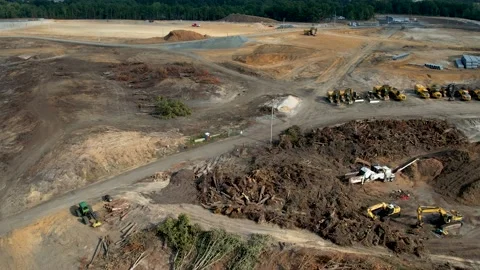Flying over a construction site with many torn down trees Video stock 206935852