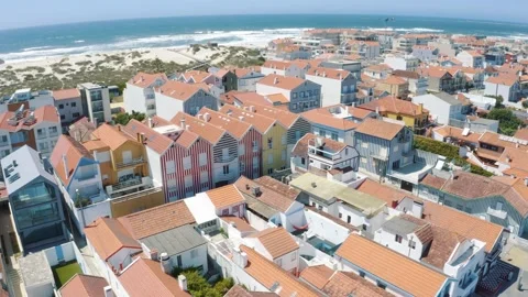 Flying over Costa Nova Do Prado in Portugal, colorful and striped houses 4K Stock Footage 162956615
