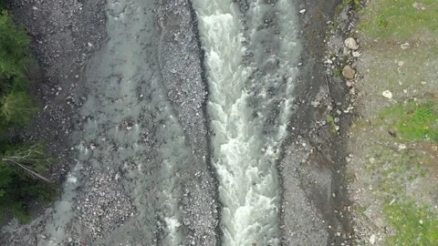 Flying over the course of a mountain river and rocky shore Stock Footage 166742477