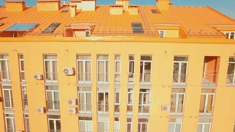 Flying over cozy comfortable colorful buildings in a European city 4K UHD aerial Stock Footage 75775083