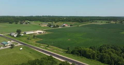 Flying over crop fields lakes farmland midwest kansas Stock Footage 329783719