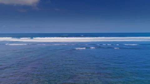 Flying over the crystal clear ocean 4 Stock Footage 121307149