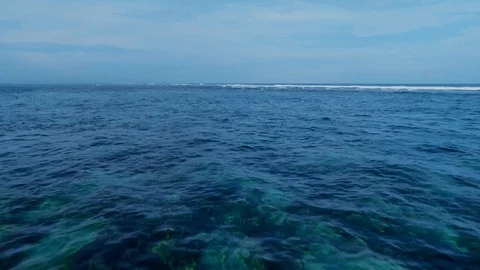 Flying over the crystal clear ocean 6 Stock Footage 121307615