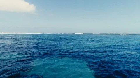 Flying over the crystal clear ocean 3 Stock Footage 121308100