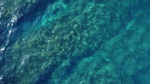 Flying over crystal clear turquoise water Stock Footage 232358839