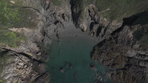 Flying over the crystal clear waters of Guernsey Stock Footage 288742168