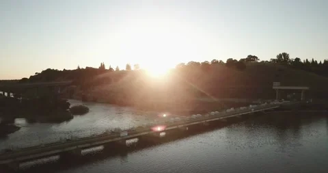 Flying over dam during sunset Stockbeeldmateriaal 134911603