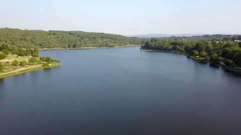 FLYING OVER A DAM SUNNY DAY Stock Footage 111577955