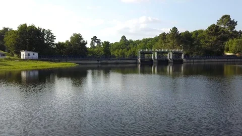 FLYING OVER A DAM SUNNY DAY Stock Footage 111577983