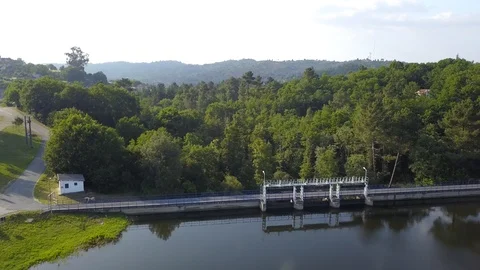 FLYING OVER A DAM SUNNY DAY Stock Footage 111578086