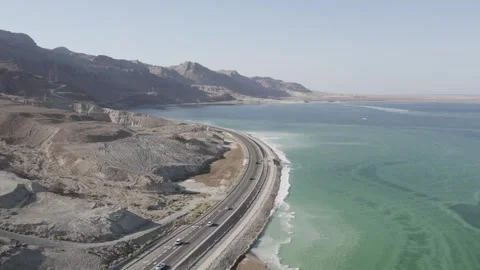 Flying over the Dead Sea and a road running next to it Stock Footage 240311859