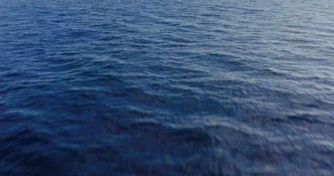 Flying over deep blue ocean Stock Footage 115061320