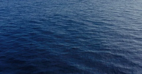 Flying over deep blue ocean Stock Footage 115061375