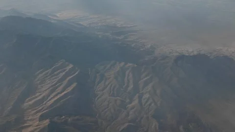 Flying Over the Desert Mountains Toward Las Vegas Nevada Stock Footage 303358486