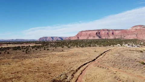 Flying over a desert plane towards mountains in Kanab, Utah Video stock 153249563