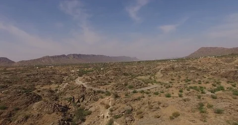 Flying over a desert with shrubs Stock Footage 80982867
