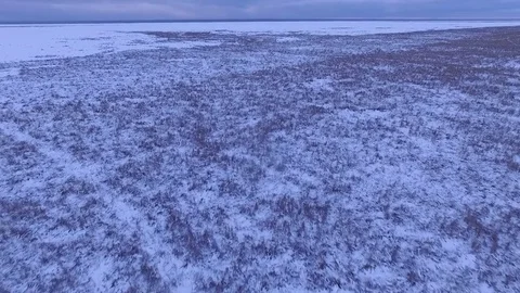 Flying over deserted landscape 4K Stock Footage 82881918