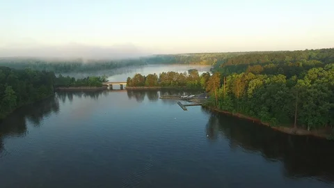 Flying Over Docks and Bridge, Falls Lake, North Carolina Stock Footage 128527039