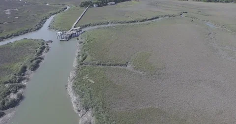Flying Over Docks in Marsh 4K Vídeos de archivo 84041965