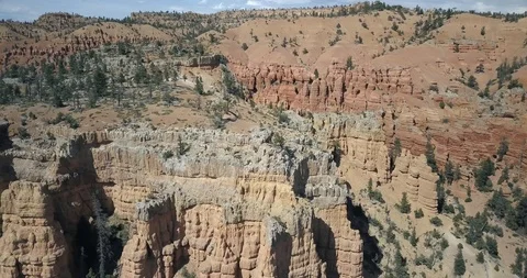 Flying over the dramatic landscape of Red Canyon in Dixie National Forest Stock Footage 119346875